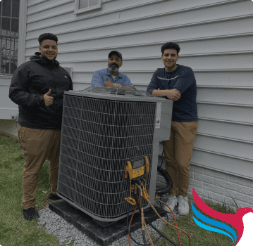 Eagles HVAC technicians standing beside an outdoor AC condenser at a Chantilly home